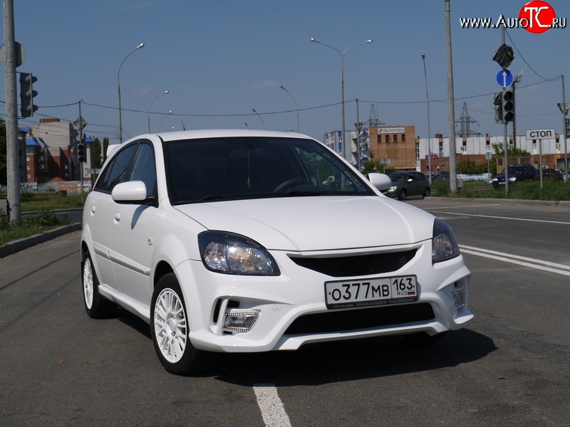 10 999 р. Передний бампер Vita Dm  KIA Rio ( 2 JB,  4 FB) (2005-2025) дорестайлинг седан, дорестайлинг, хэтчбэк 5 дв., рестайлинг, хэтчбэк 5 дв., рестайлинг седан (Без сетки, Неокрашенный)  с доставкой в г. Горно‑Алтайск